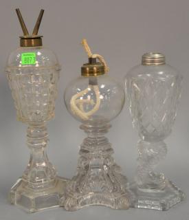 Appraisal: Three clear glass oil lamps two are sandwich pressed glass