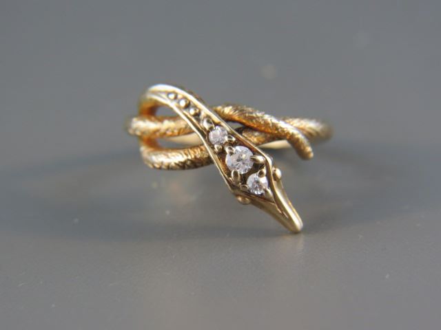 Appraisal: Diamond Figural Snake Ring a trio of round diamonds in