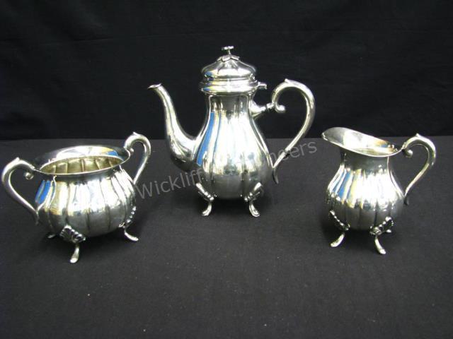 Appraisal: Danish Silverplate Tea Service including teapot with floral finial tall