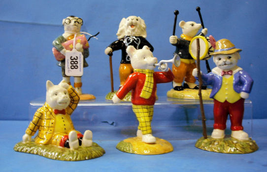 Appraisal: A Collection of Royal Doulton Figures from Rupert Bear series