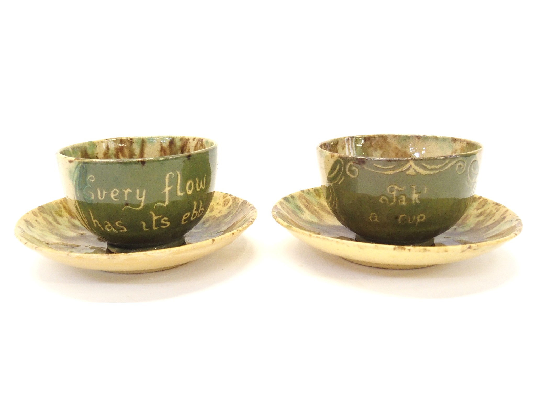 Appraisal: Pair of Dunmore Pottery teacups with saucers