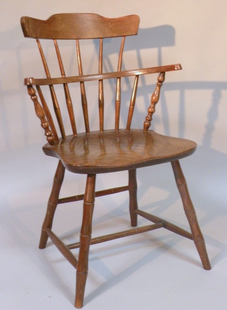 Appraisal: A thC style child's beech comb back Windsor chair in