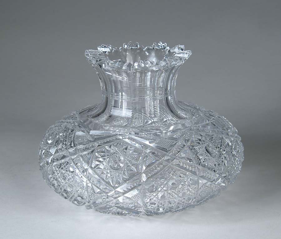 Appraisal: CUT GLASS CENTERPIECE VASE Heavily cut in hobstar and cane