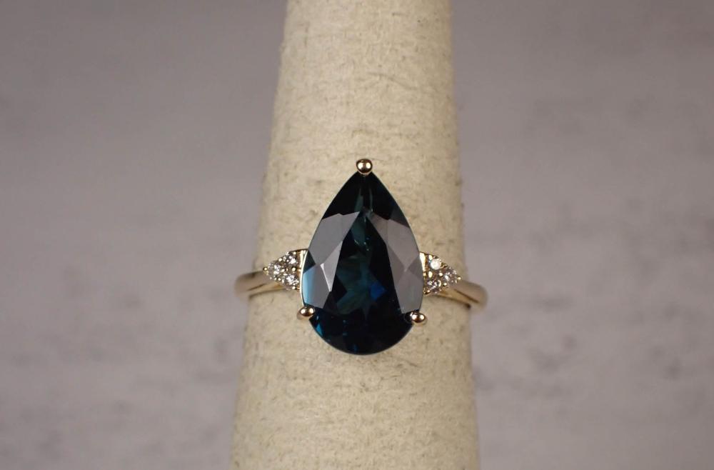 Appraisal: BLUE TOPAZ DIAMOND AND FOURTEEN KARAT GOLD RING The yellow