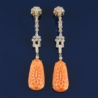 Appraisal: A pair of coral and diamond drop earrings The carved