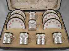 Appraisal: A cased porcelain and silver tea set the porcelain cups