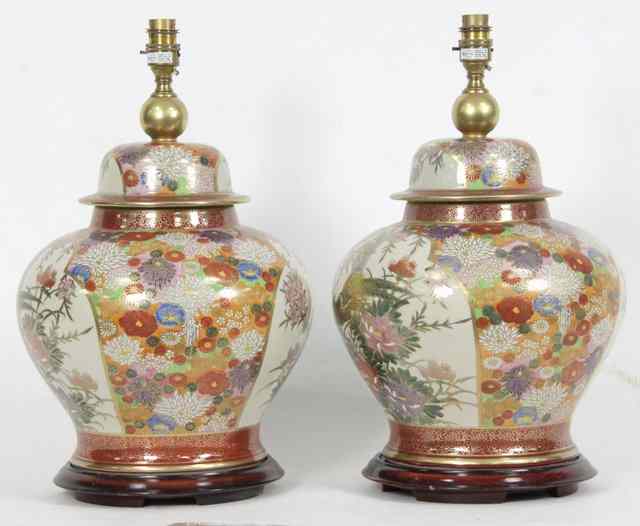 Appraisal: A pair of Japanese Satsuma style baluster vases and covers