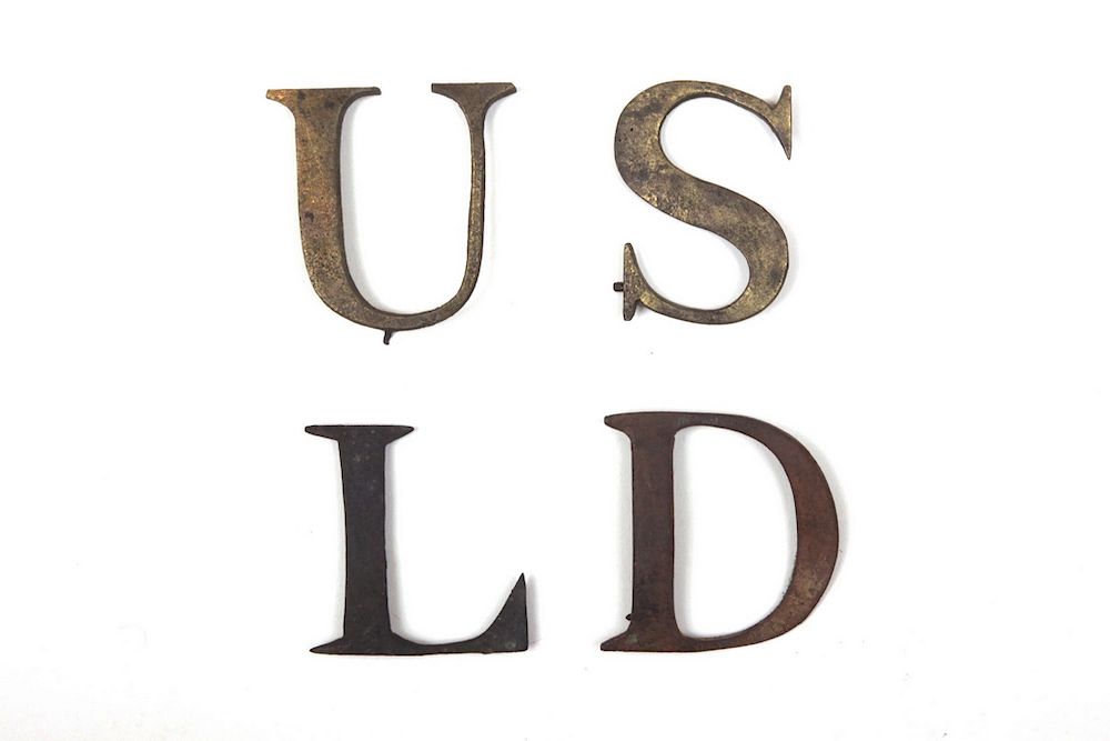 Appraisal: US LIGHT DRAGOON CAP LETTERS Cast-brass with small clinches on