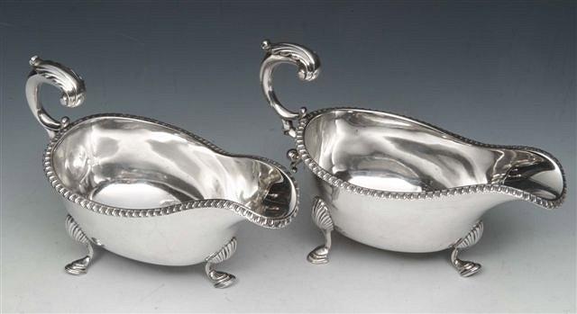 Appraisal: A PAIR OF VICTORIAN SILVER SAUCE BOATS with gadrooned edges