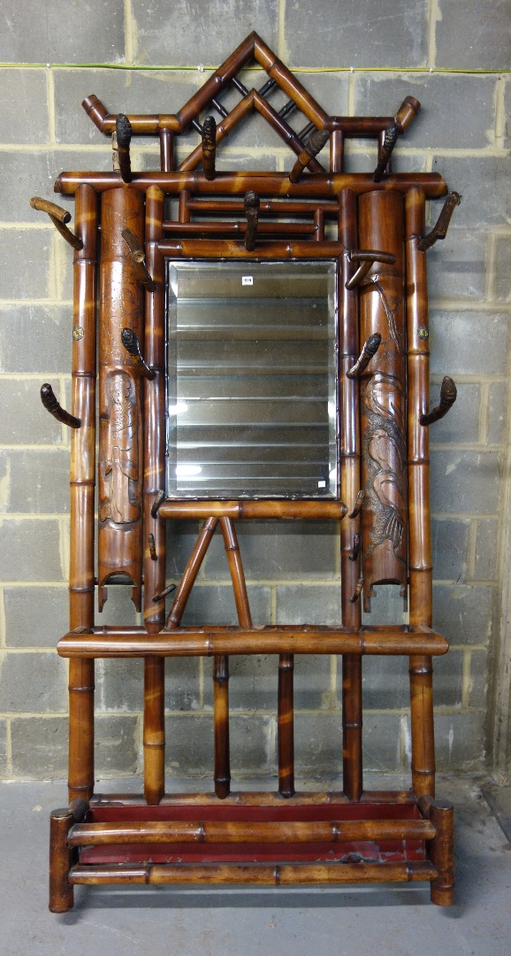 Appraisal: An early th century split bamboo mirror back coat umbrella