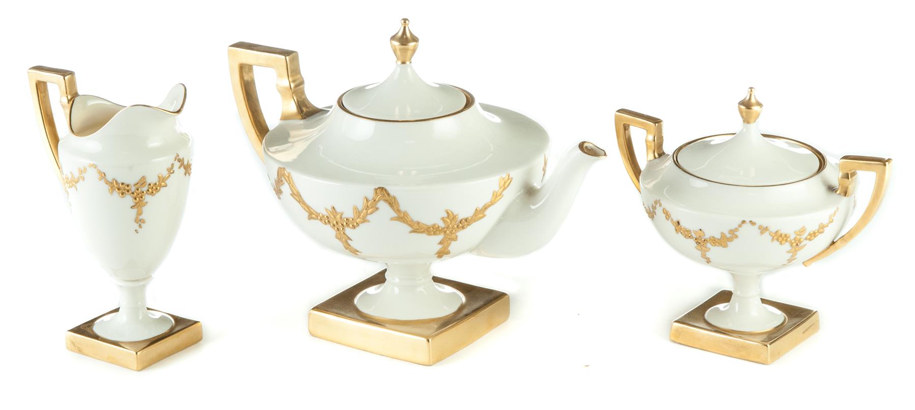 Appraisal: THREE PIECES OF LENOX BELLEEK TEA SET American st half-