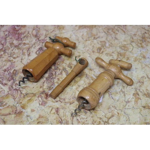 Appraisal: Three treen cork screws