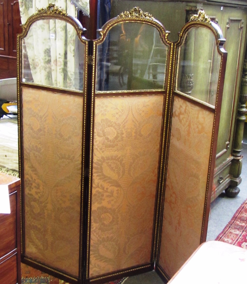 Appraisal: A late th century parcel gilt mahogany framed three fold