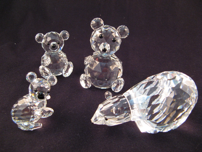 Appraisal: FOUR SWAROVSKI AUSTRIAN CUT CRYSTAL FIGURES including a Polar Bear