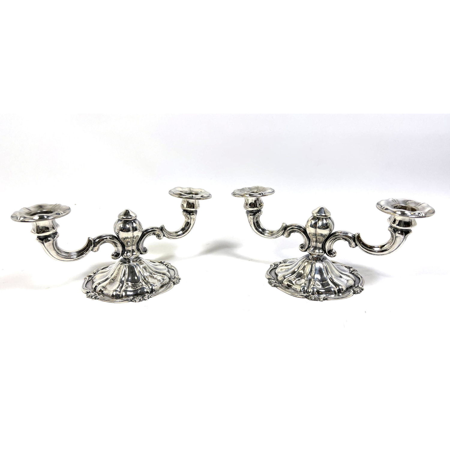 Appraisal: PAIR PERUVIAN STERLING SILVER CANDLESTICKS TWO ARMS INDUSTRIA PERUANA CAMUSSO