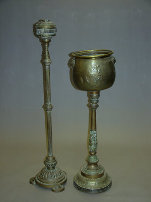 Appraisal: A large brass jardiniere on pedestal base lion mask handles