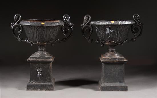 Appraisal: Pair of classical style painted cast metal two-handled urns and