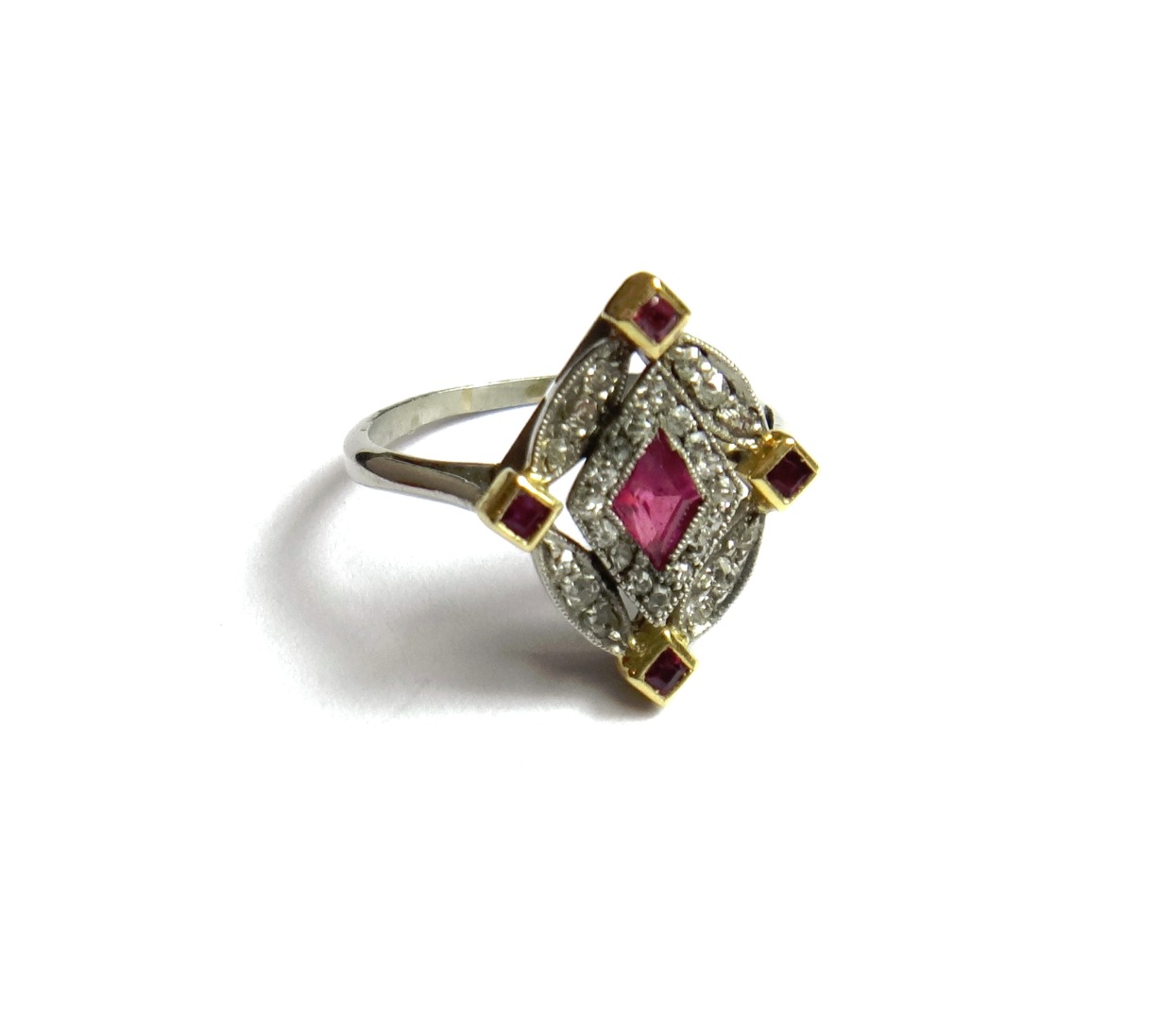 Appraisal: A ruby and diamond set oval cluster ring mounted with