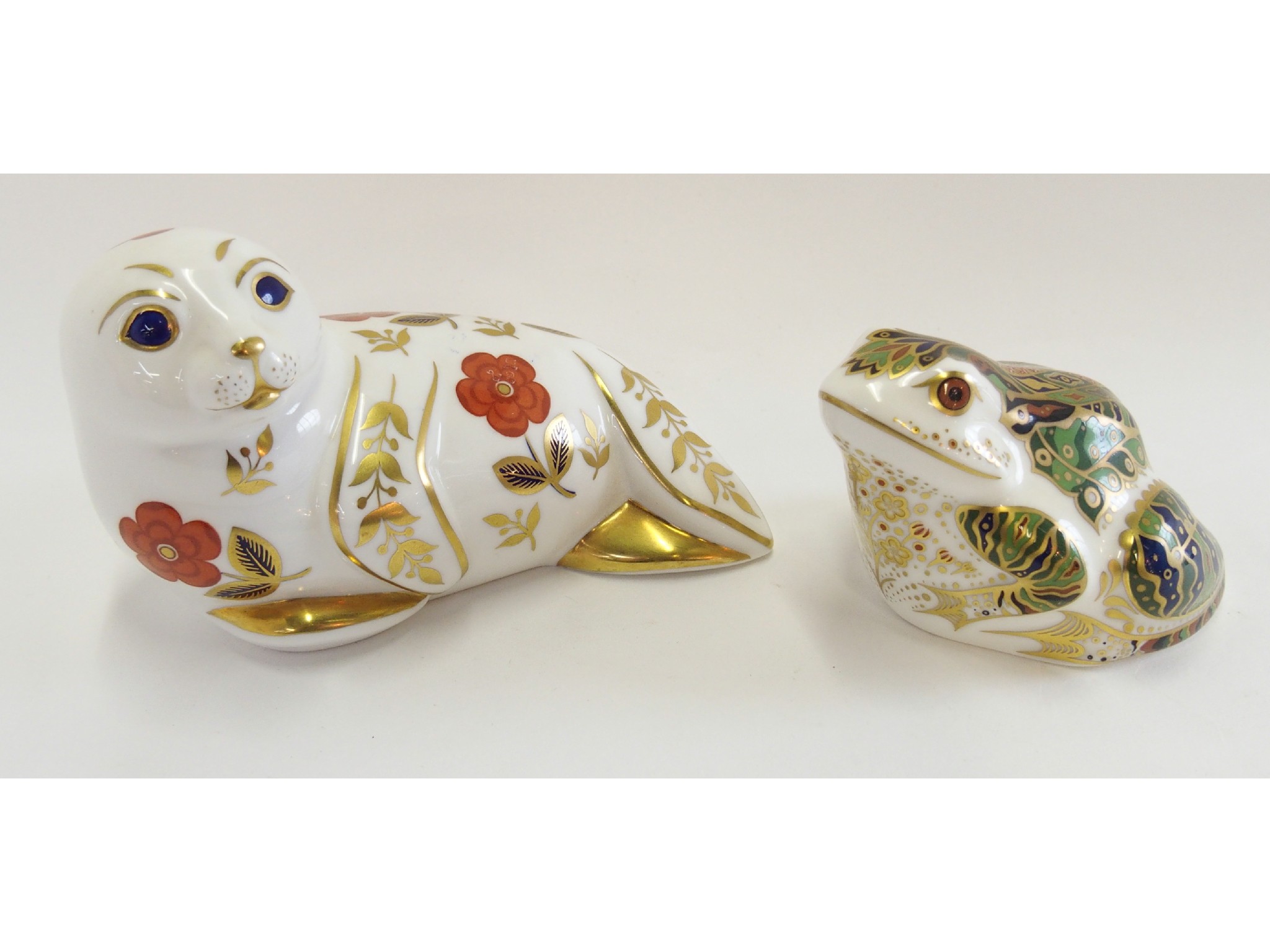 Appraisal: Two Royal Crown Derby porcelain paperweights of a seal and