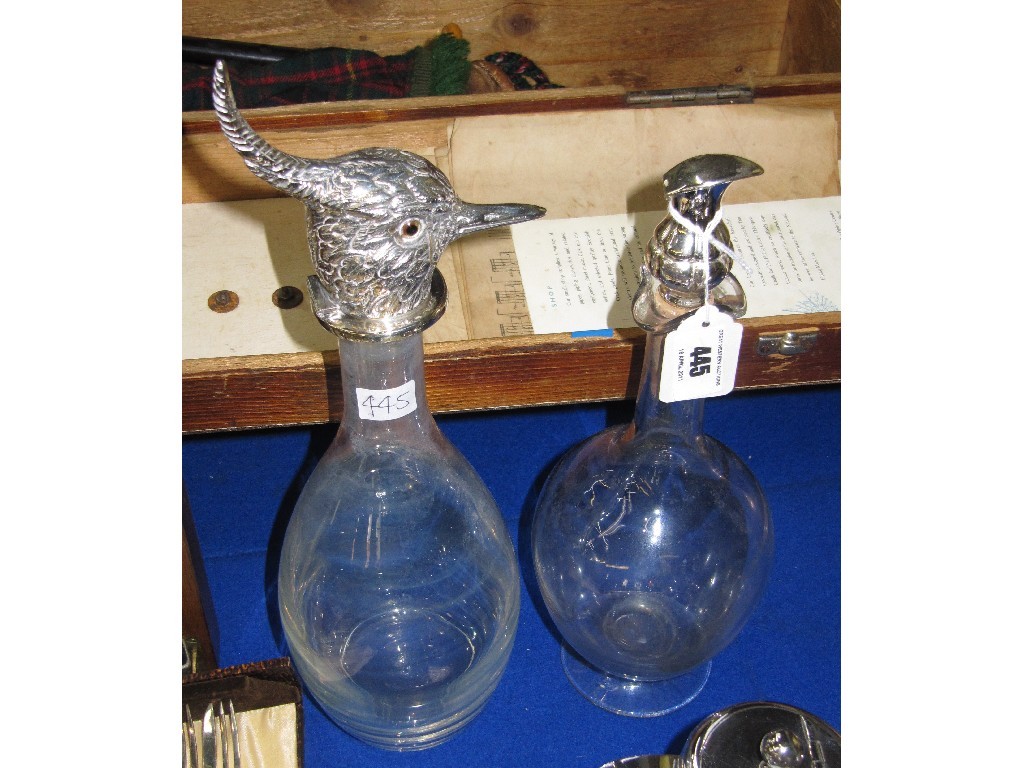 Appraisal: Lot comprising two silver plated topped decanters one with top