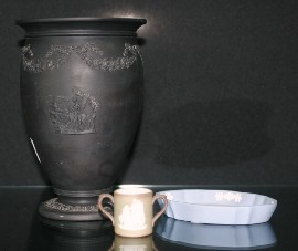 Appraisal: A Wedgwood black basalt urn decorated with rose garlands and