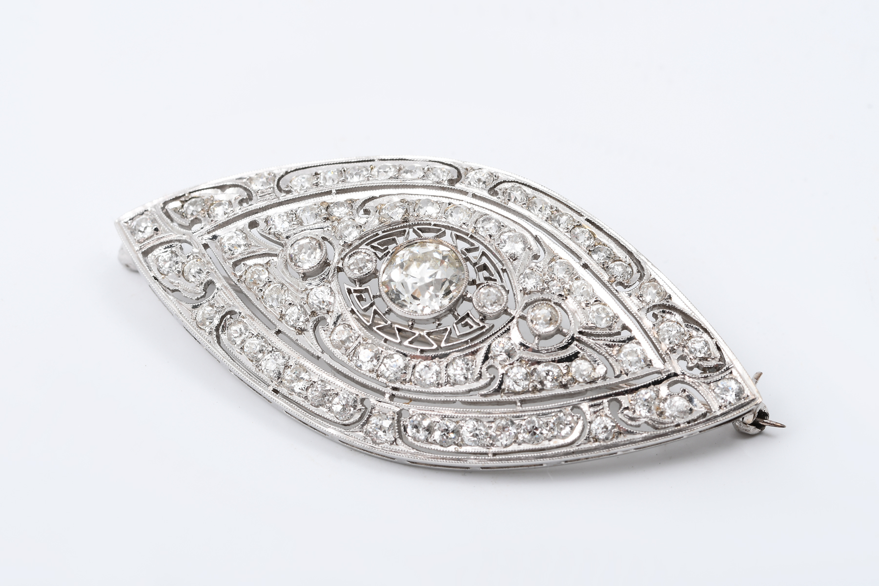 Appraisal: PLATINUM CTW EDWARDIAN BROOCH Beautifully detailed Edwardian brooch features CT