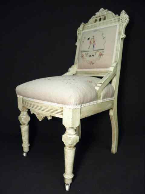 Appraisal: Cream colored Eastlake-style needlepoint side chair Upholstered with figural light