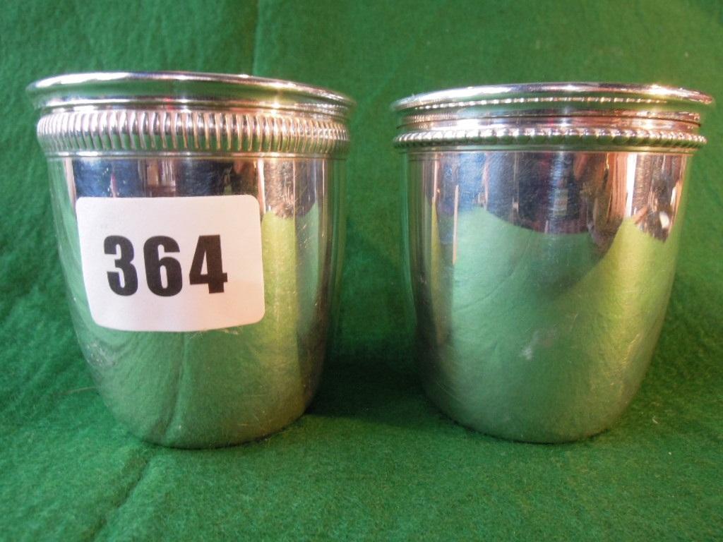 Appraisal: A near pair of French silver beakers with reeded rims