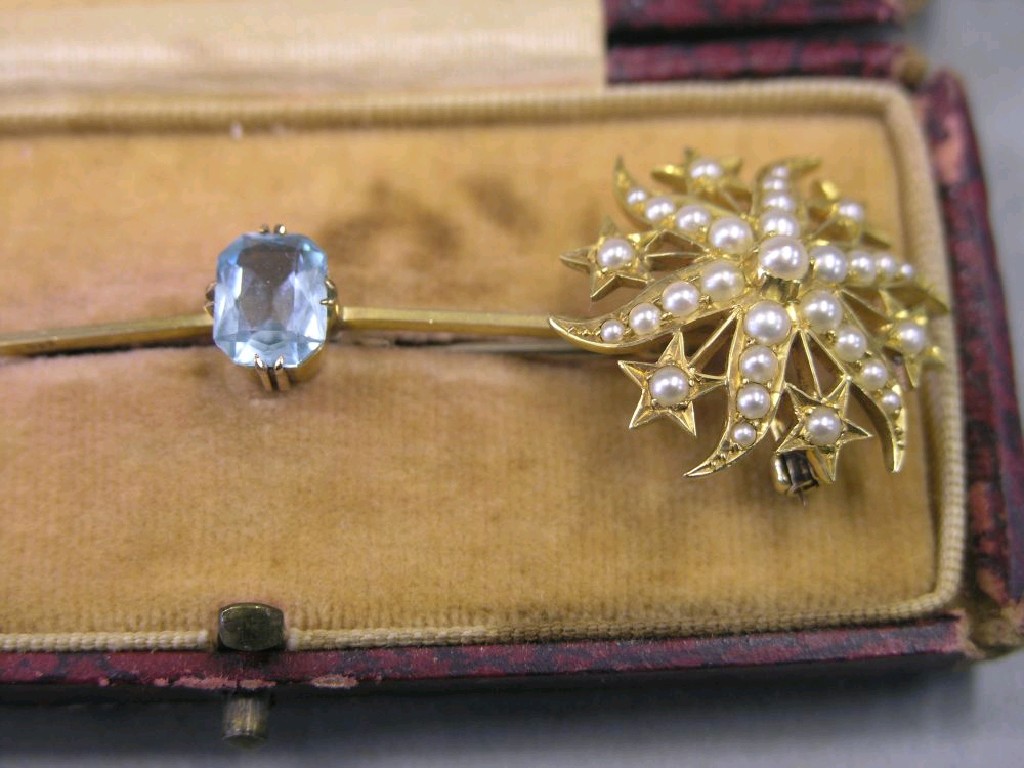 Appraisal: A gold-coloured metal rosette brooch applied with seed pearls together