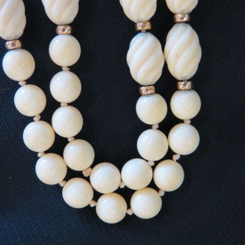 Appraisal: Carved Ivory Necklace k yellow gold spacers oval swirl beads