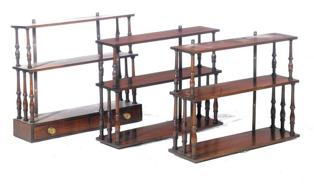 Appraisal: A SET OF THREE MAHOGANY THREE TIER HANGING SHELVES with