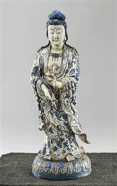 Appraisal: Chinese blue and white porcelain standing Buddha with flower and