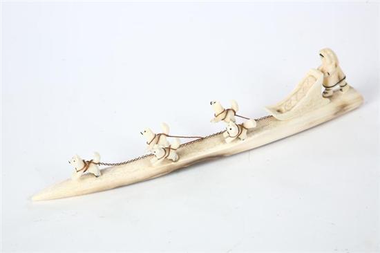 Appraisal: CARVED IVORY DOG SLED TEAM From Grenfell th century Carved