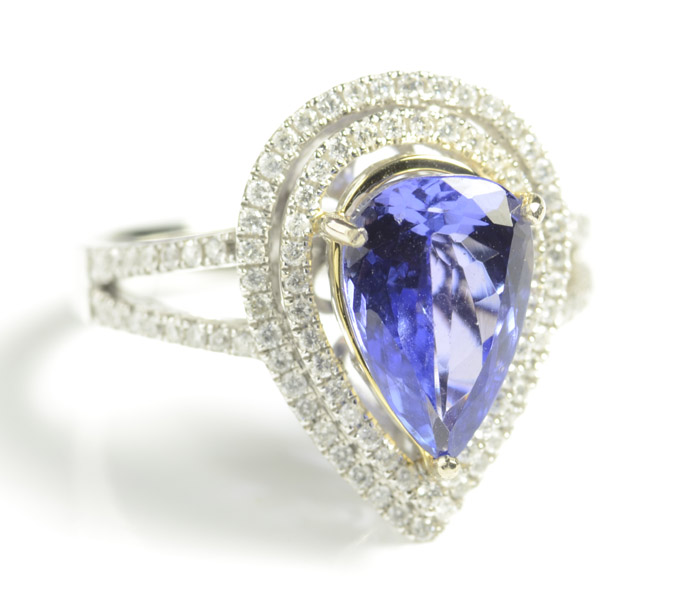 Appraisal: TANZANITE DIAMOND AND FOURTEEN KARAT GOLD RING with round-cut diamond