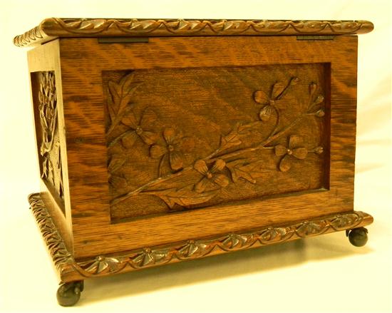 Appraisal: Wooden box carved with floral motif on small ball and