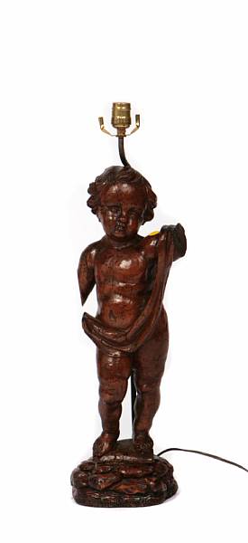 Appraisal: A Italian carved figure a putti now mounted as a