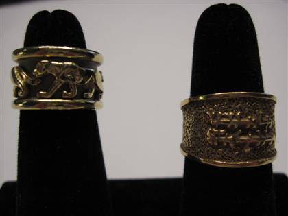 Appraisal: Two yellow gold band ringsOne with the Cartier style panthers