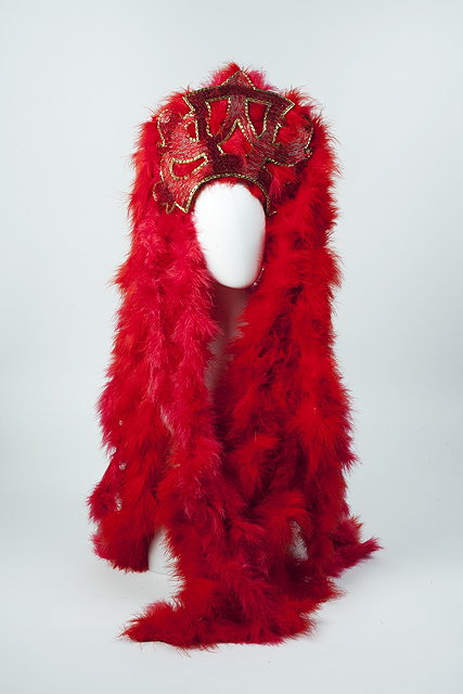 Appraisal: A red and gold beaded headdress worn in the film