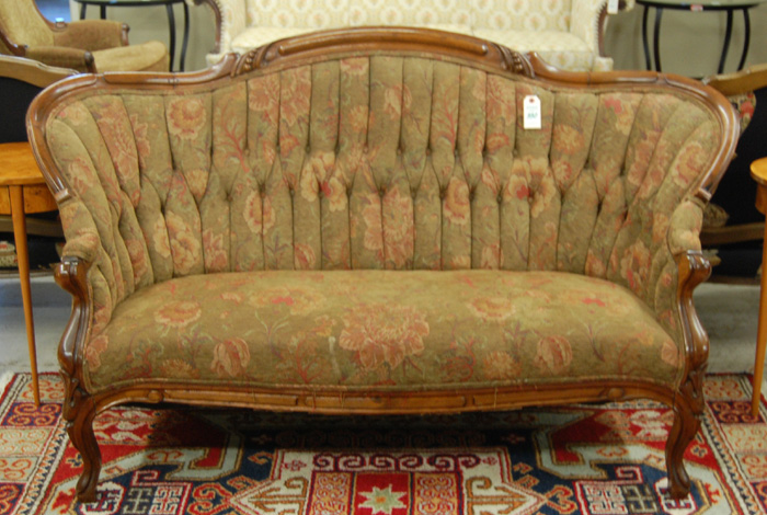 Appraisal: VICTORIAN SERPENTINE-ARCH SOFA Rococo Revival design American last quarter of