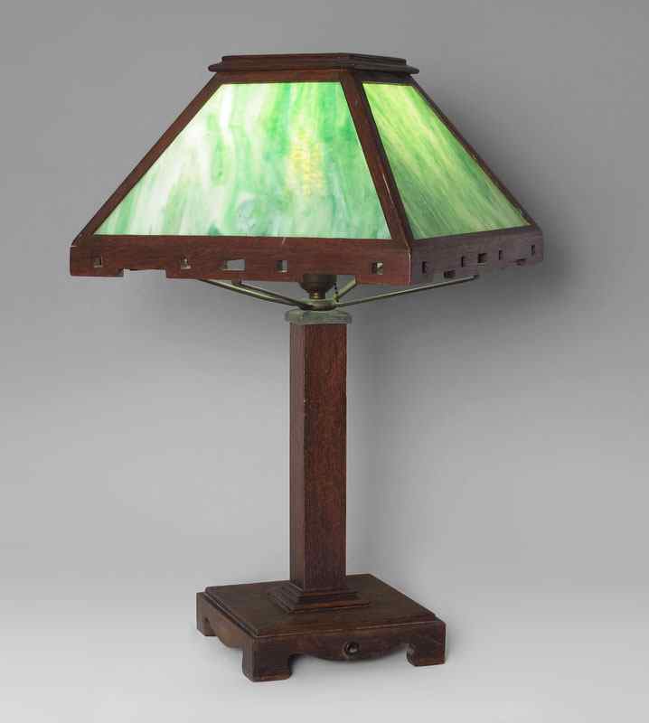 Appraisal: ARTS CRAFTS OAK LAMP Oak trim and base metal supports