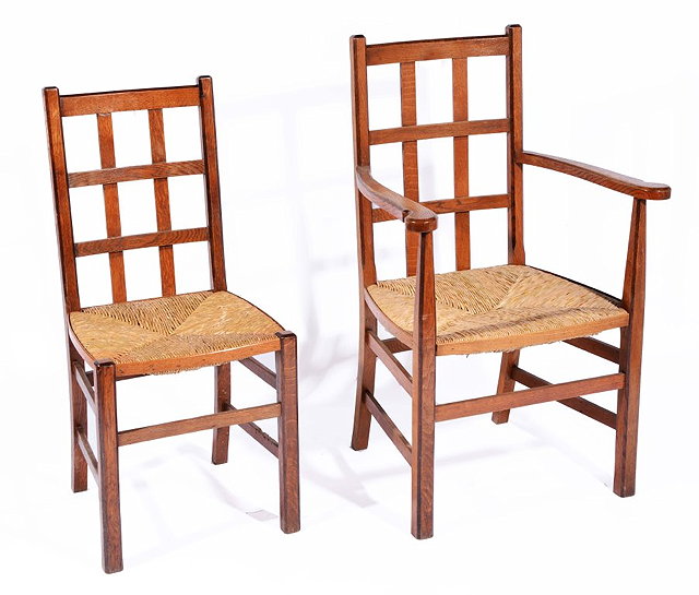 Appraisal: A SET OF SIX OAK DINING CHAIRS attributed to Liberty