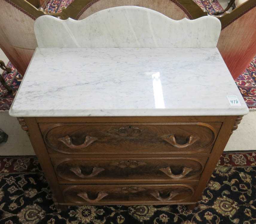 Appraisal: A VICTORIAN MARBLE-TOP WALNUT WASHSTAND American c a small -drawer