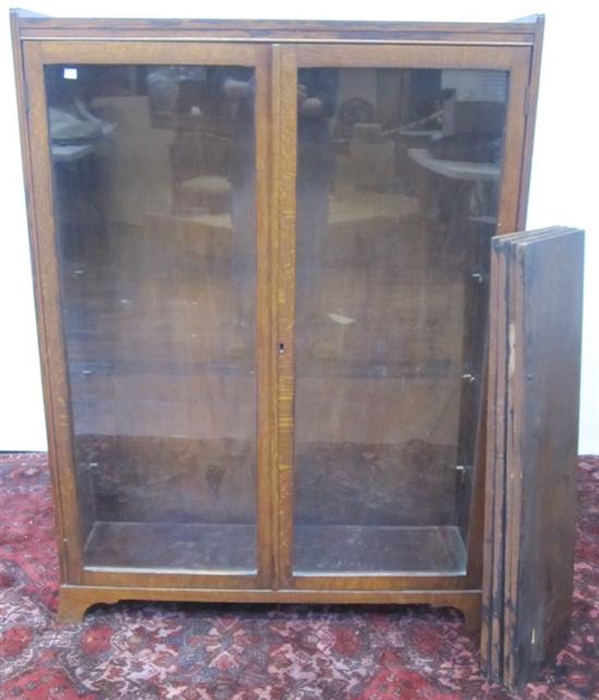 Appraisal: BOOKCASE A turn-of-the -century mission style oak bookcase fitted with