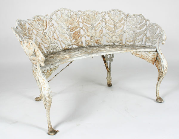 Appraisal: Ornate white cast iron bench arms ending in griffin heads