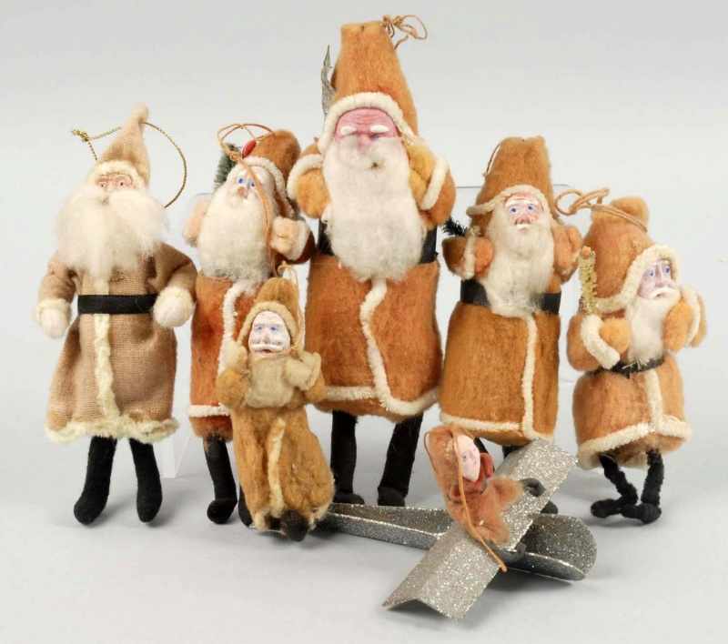 Appraisal: Lot of Japanned Santa Figures Condition Very Good - Excellent