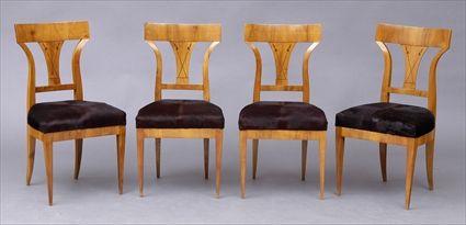 Appraisal: FOUR GERMAN BIEDERMEIER INLAID-WALNUT SIDE CHAIRS Each curved top rail