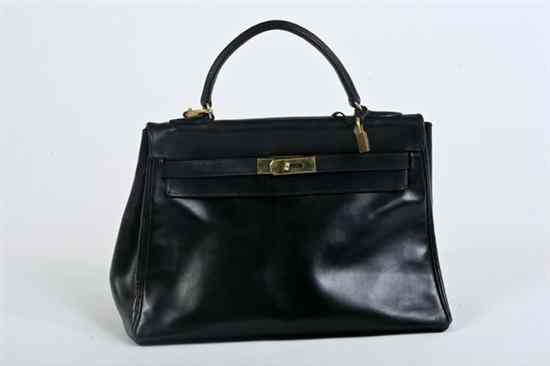 Appraisal: HERM S BLACK LEATHER KELLY BAG Single compartment interior with