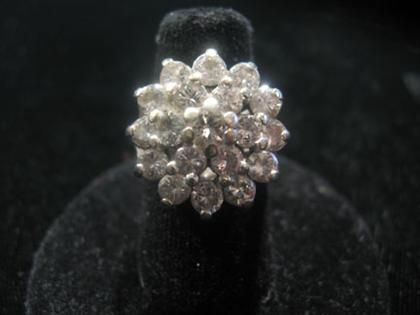 Appraisal: White gold and diamond cluster ring th century Three rows