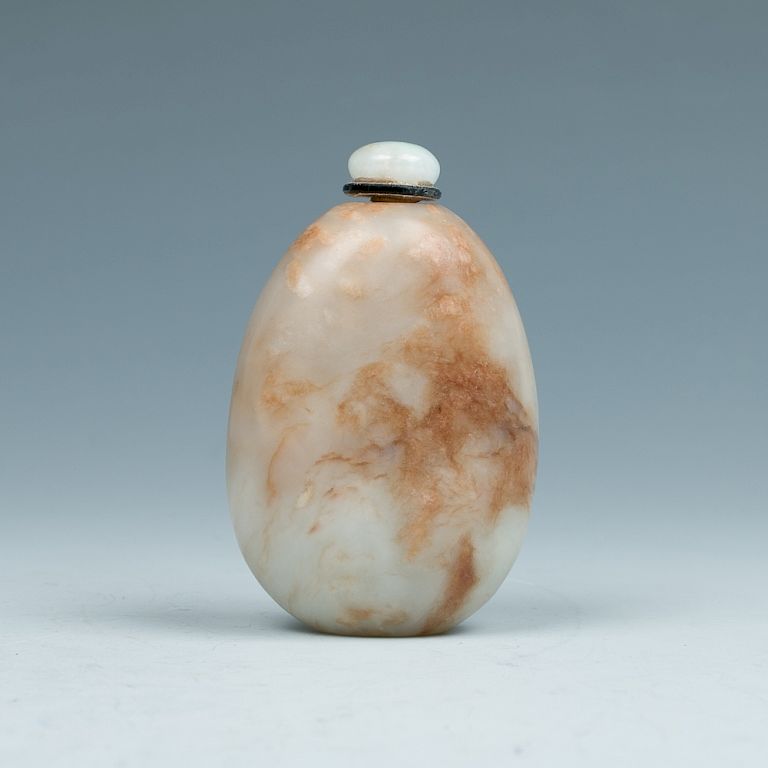 Appraisal: WHITE JADE SNUFF BOTTLE WITH RUSSET INCLUSIONS Of an ovular