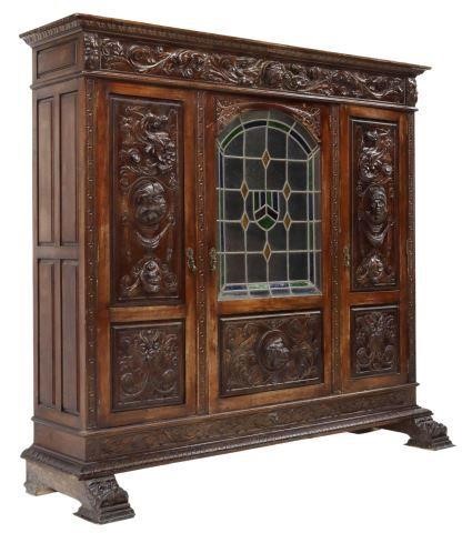 Appraisal: Spanish Renaissance Revival oak library bookcase th c having highly